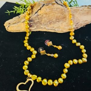 20" hand knotted 6 mm fresh water, chartreuse pearls with gold tone heart pendant and magnetic clasp.