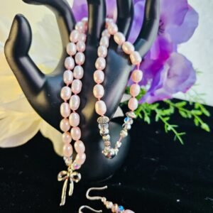 20" hand knotted necklace and earrings fresh water pink pearls and stainless steel bow pendant and magnetic clasp.