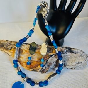 18" necklace and earrings and 1" pendant in aqua swirl glass from Ghana, Africa and stainless steel accents.