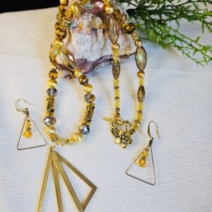 24" necklace and earrings with 2 1/2 " pendant in faceted glass and gold tone beads.