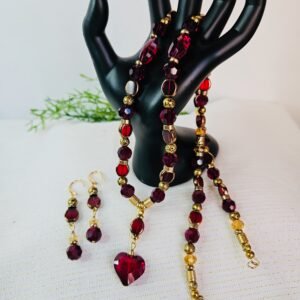 24" necklace and earrings with Czech and faceted glass beads with red and gold tone accents.