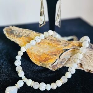 18" necklace and 2" earrings with white glass and metal beads. Stainless steel accents.