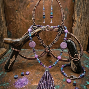 26" Purple and Blueish Necklace of Jasper, Tigereye, and Resin Beads with a Purple Crystal Tassel. Paired with a Matching Bracelet and Huggy Earrings.