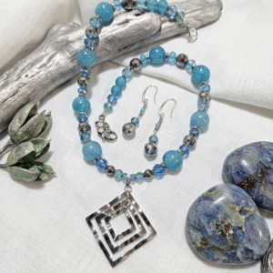 22" Baby Blue Galaxy Shimmer of Glass Beads with a Silver Geometric Square Pendant.